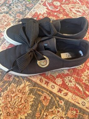 Adidas Sleek Black Slip-On Sneakers with Bow and Gold Emblem